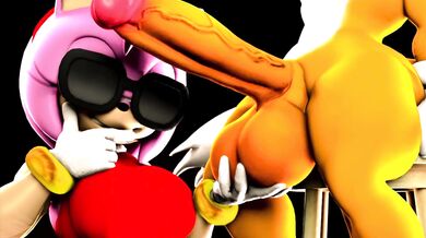 Amy Rose grabs Tails’ penis and rides him hard in the ocean while he tries to escape her clutches, but she won’t let go!