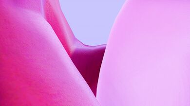 A nude magician practices her trade in an electrifying way as she controls a high-powered 4K TV