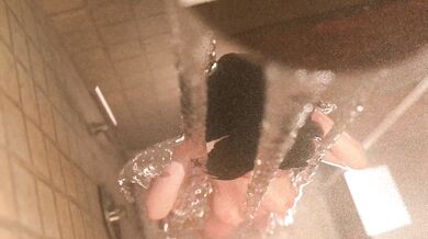"My hot and sexy Aunt Cass takes a steamy shower in her skimpy bikini, teasing the camera with her wet body and luscious curves."