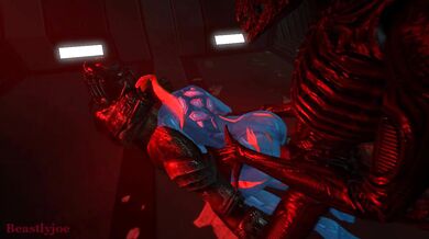 'Alien creatures make love to the heroine in her power suit'