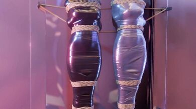 Two girls in sexy lingerie get tied up and mummified with electrical tape and duct tape for your pleasure